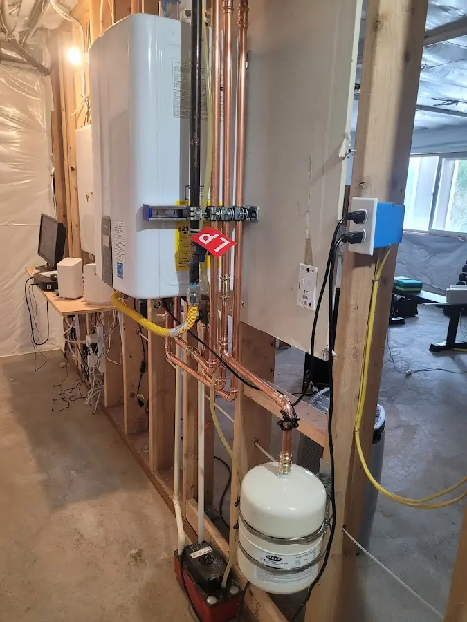 Licensed plumber repairing a kitchen sink in Medina