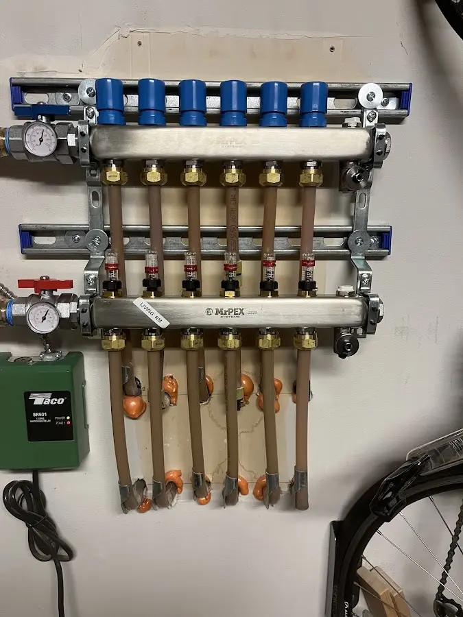 Plumber performing Water Heater Repair at a residential property in Medina